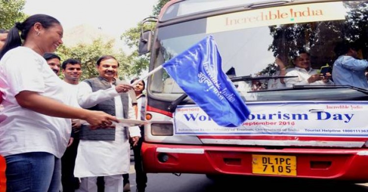 dr. mahesh sharma flagged the tourist bus of children with disabilities