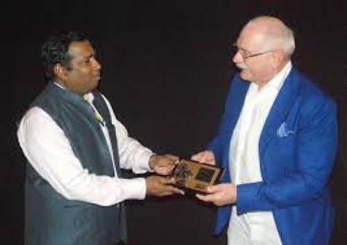 c. senthil rajan felicitating the awardee nikita milkalkov