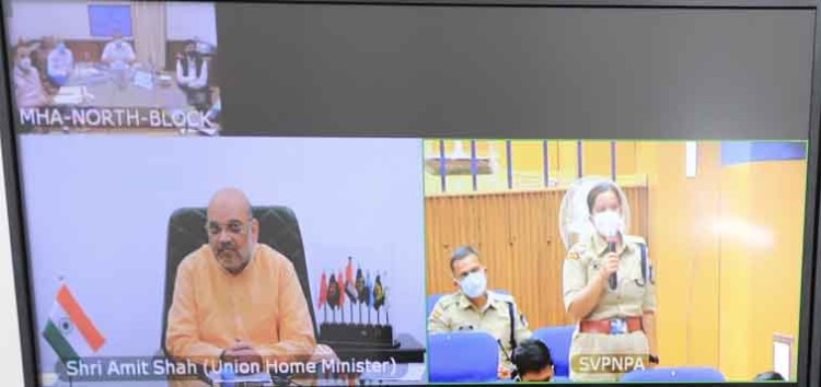home minister interacts with probationary officers of ips through video conferencing