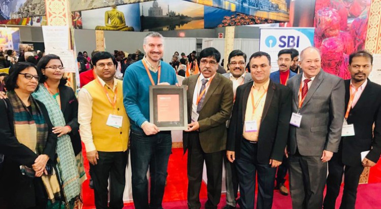 secretary ministry of tourism yogendra tripathi receiving excellence award