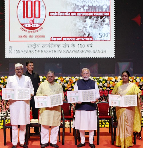 pm narendra modi released a special postage stamp and a rs 100 coin on the rss