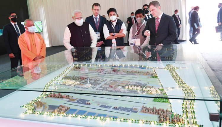 narendra modi visiting an exhibition on noida international airport, jewar