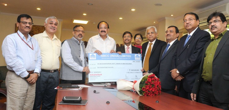 nbcc, presenting the dividend cheque venkaiah naidu