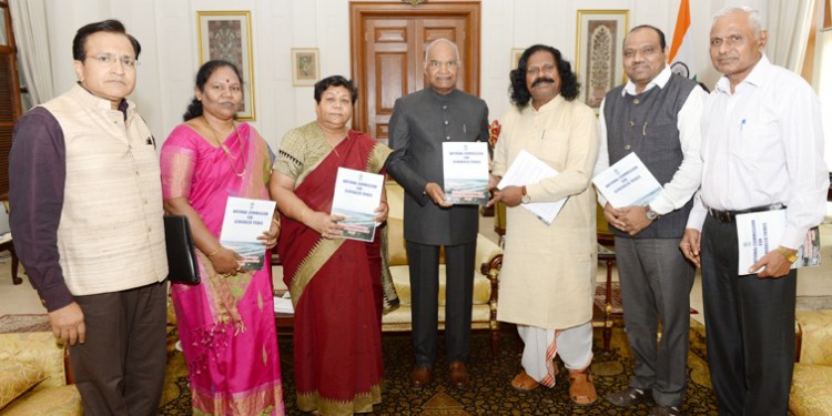 ramnath kovind being presented a special report of the commission