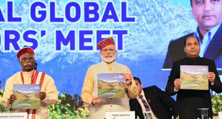 narendra modi releasing the coffee table book, at the global investors' meet 2019