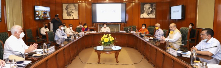 amit shah chairing a review meeting on the management of covid-19 in delhi ncr