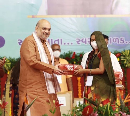 home minister distributed nutritious laddus to pregnant women in gandhinagar