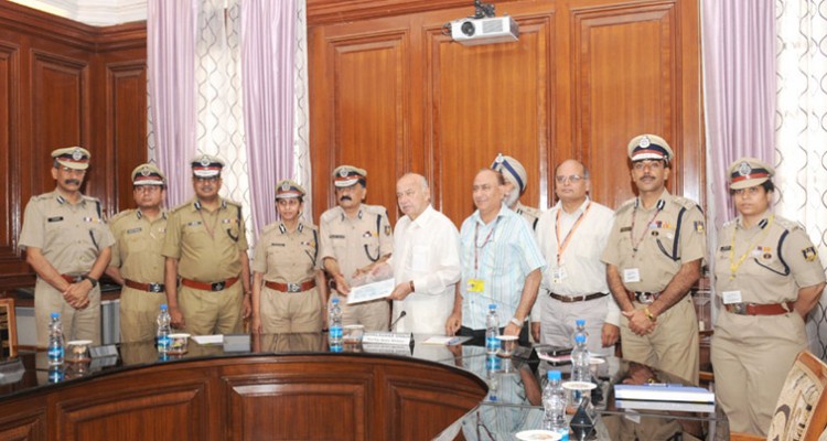 the union home minister, sushil kumar shinde receiving the cheque for uttarakhand relief from the dg, crpf, pranay sahay