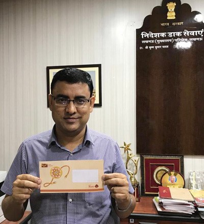 director postal sh. kk yadav depicting rakhi envelope