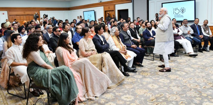 narendra modi interacting with the film stars during the release of four cultural videos