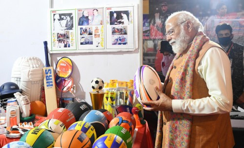 pm visiting an exhibition in ceremony of major dhyan chand sports university